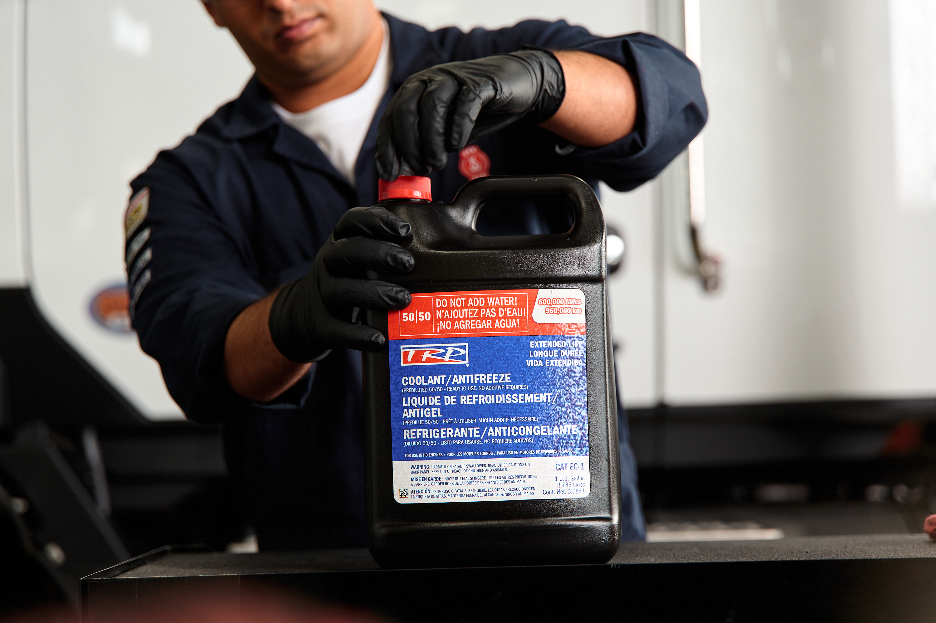 Kenworth service tech filling coolant